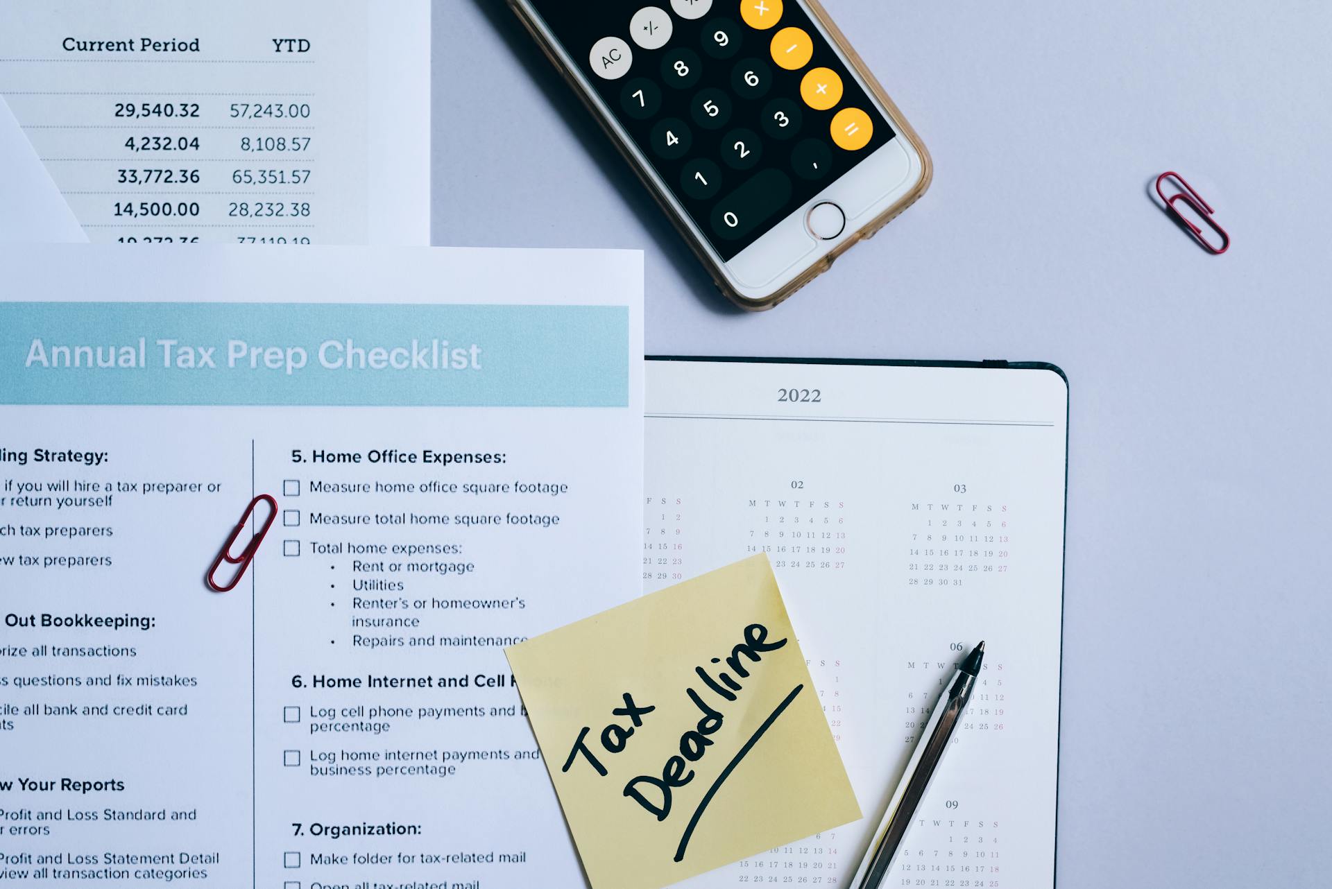 A Sticky Note and a Tax Form on a Calendar