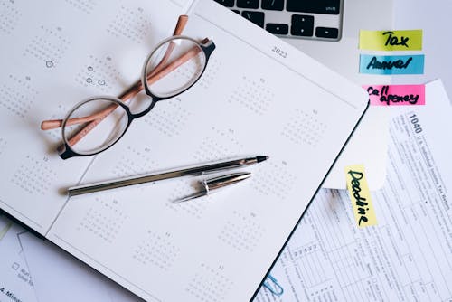 Eyeglasses and Documents on Desk