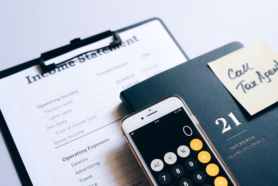 Calculator and financial documents on a desk for business accounting