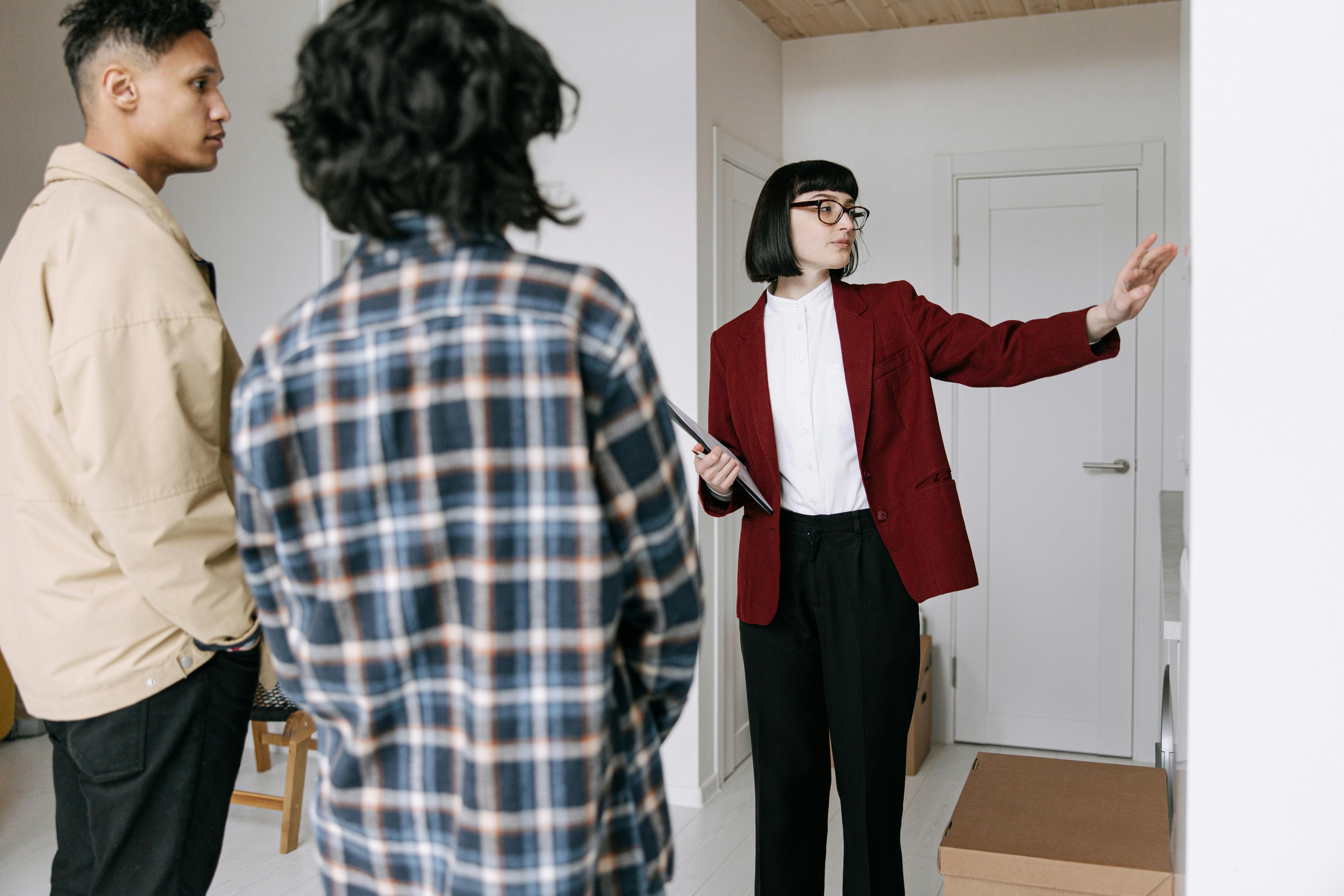 couple talking with real estate agent