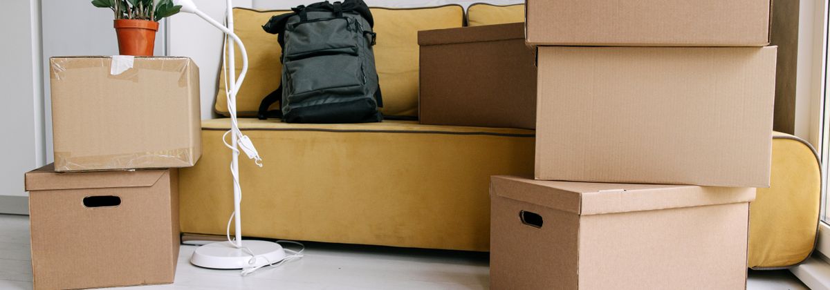 Packed moving boxes in a living room