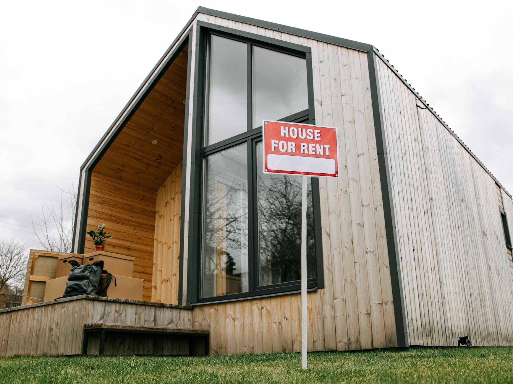 https://www.pexels.com/photo/low-angle-shot-of-wooden-house-8963083/