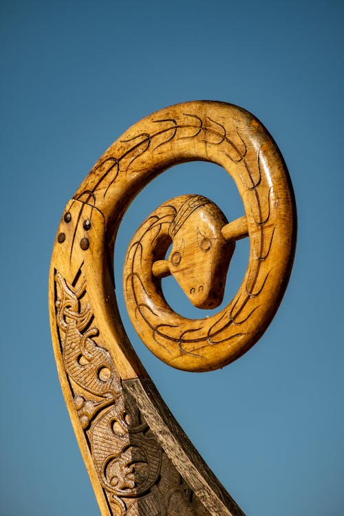 Close-up of a Detailed Carving on a Wooden Viking Ship 