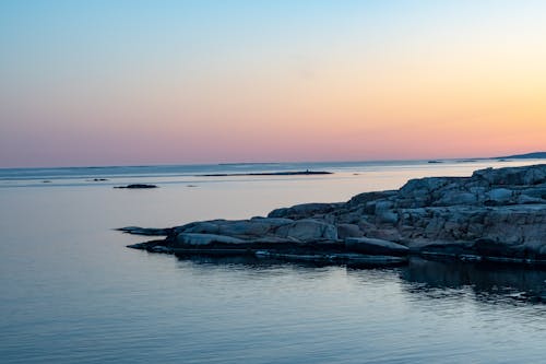 Rock Formation on the Sea during Sunset