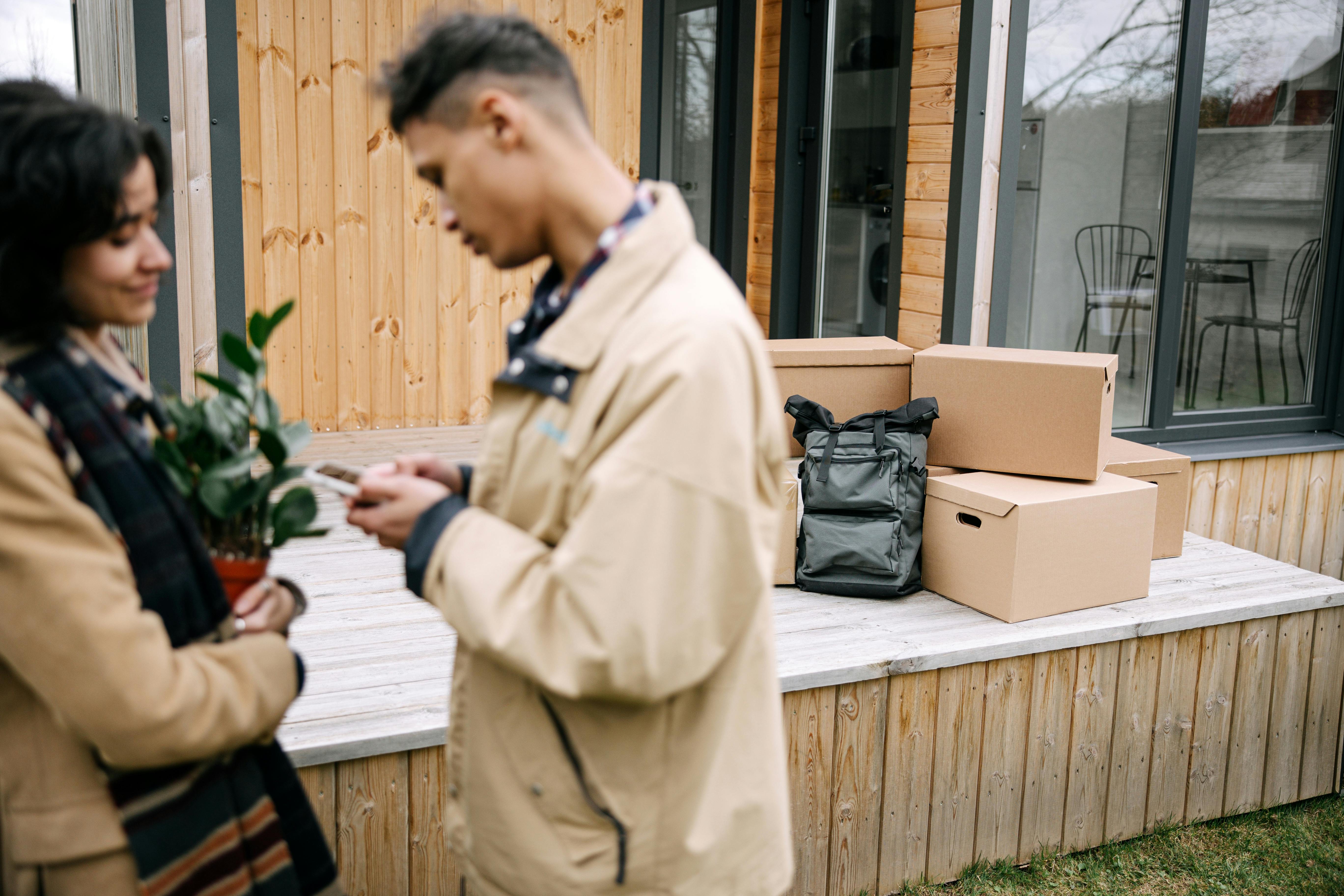 a couple standing near the carton boxes