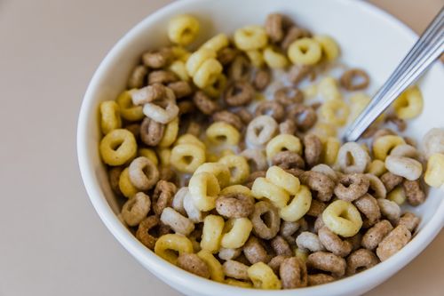 Free Close-up of a delicious and healthy cereal bowl with milk, perfect for a nutritious breakfast. Stock Photo