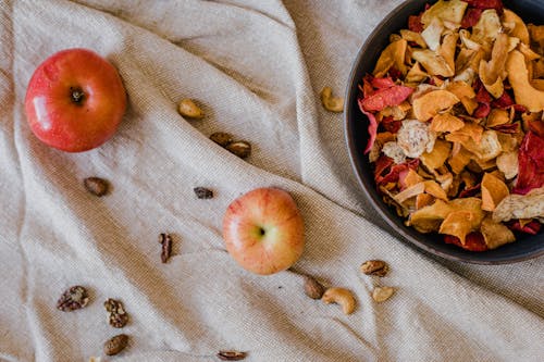 Top View of Apples and a Bowl of Dried Fruit Slices 