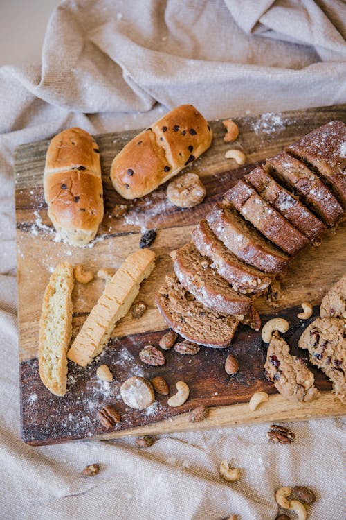 Three Baguettes On A White Plate On A Light Background. Stock