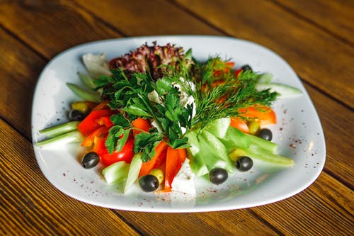 Free Sliced Vegetables on White Plate Stock Photo