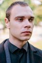 Man in Black Collared Shirt Crying