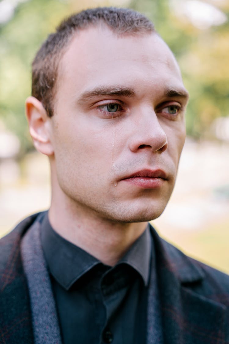 Man In Black Collared Shirt Crying