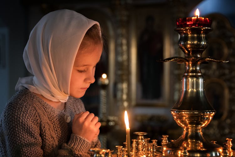 Girl In Headscarf Praying In Church