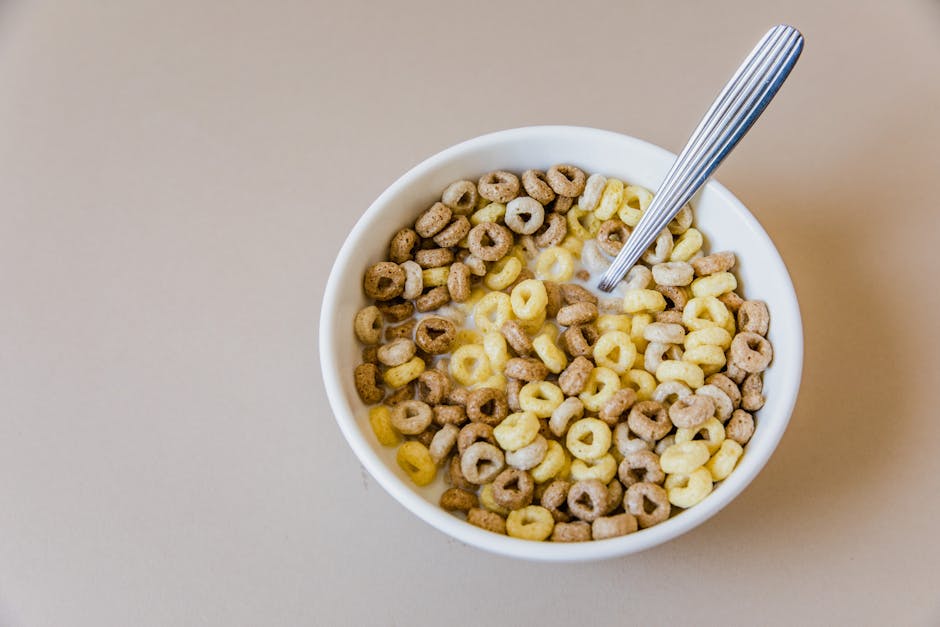 Close-up of a bowl of multi-grain cereal with milk, offering a tasty and healthy breakfast option.