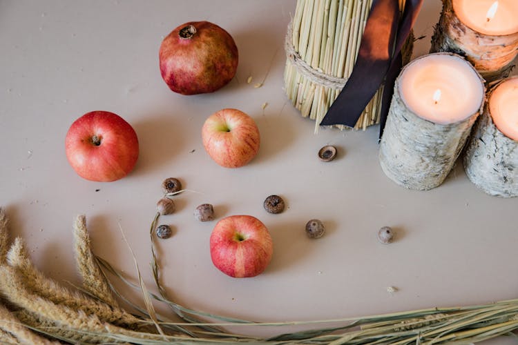 Red Apples Near The Lighted Candles 