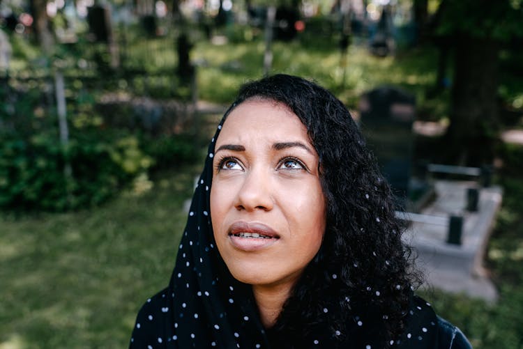 Woman In Black Hijab Looking Up