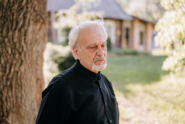 Elderly Man In Black Clothes Crying