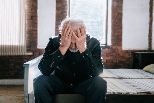 Man in Black Jacket Covering Face