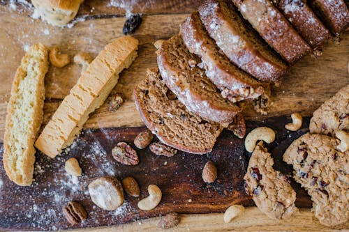 Baked Goods and Nuts on a Wooden Board