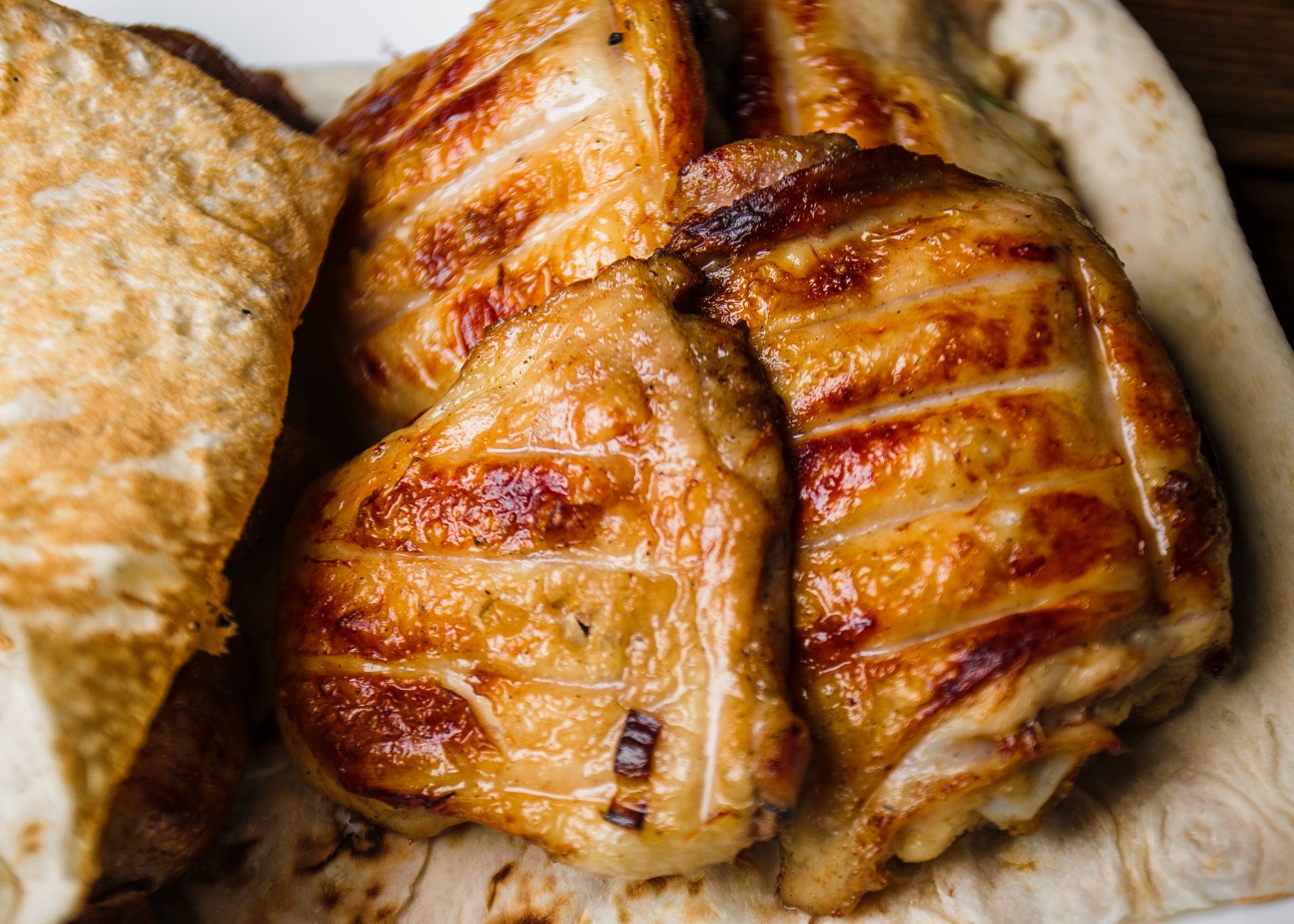 Grilled chicken breasts with spices and lemon slices