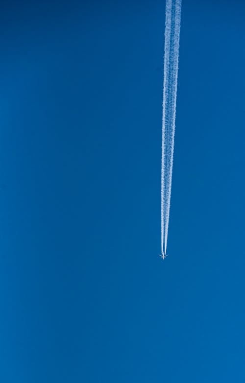 An Airplane Flying in the Blue Sky