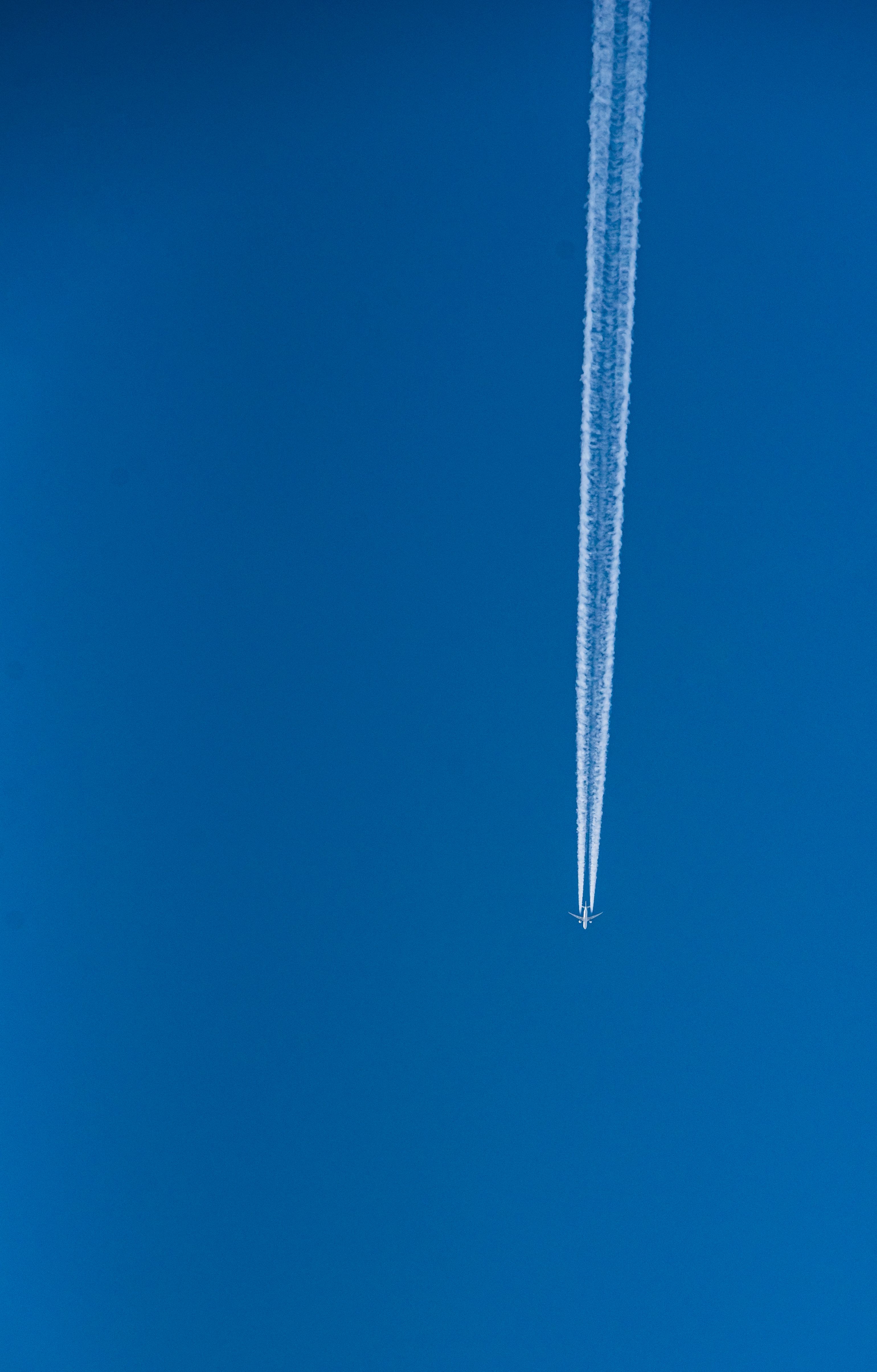 A Plane Across the Blue Sky · Free Stock Photo