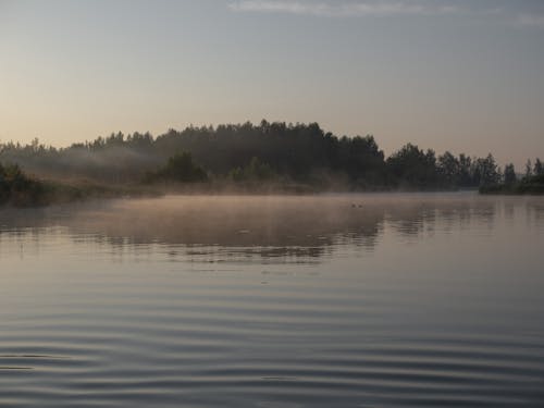 Lake and Hill in Fog at Dawn