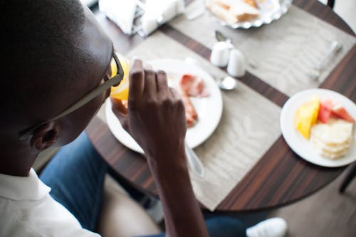 A Man Drinking Orange Juice