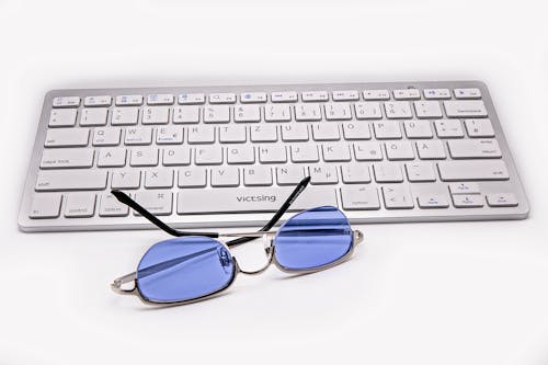Free Sunglasses and a Wireless Computer Keyboard  Stock Photo