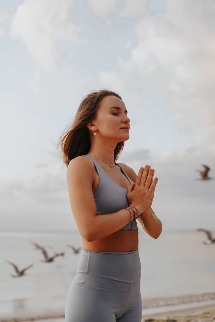 Close-Up Shot Of A Woman Doing A Yoga Exercise During Morning