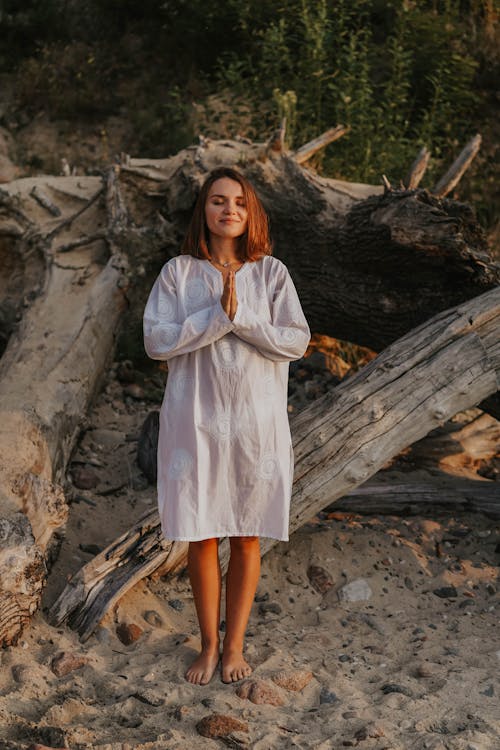 A Woman Meditating on a Beach