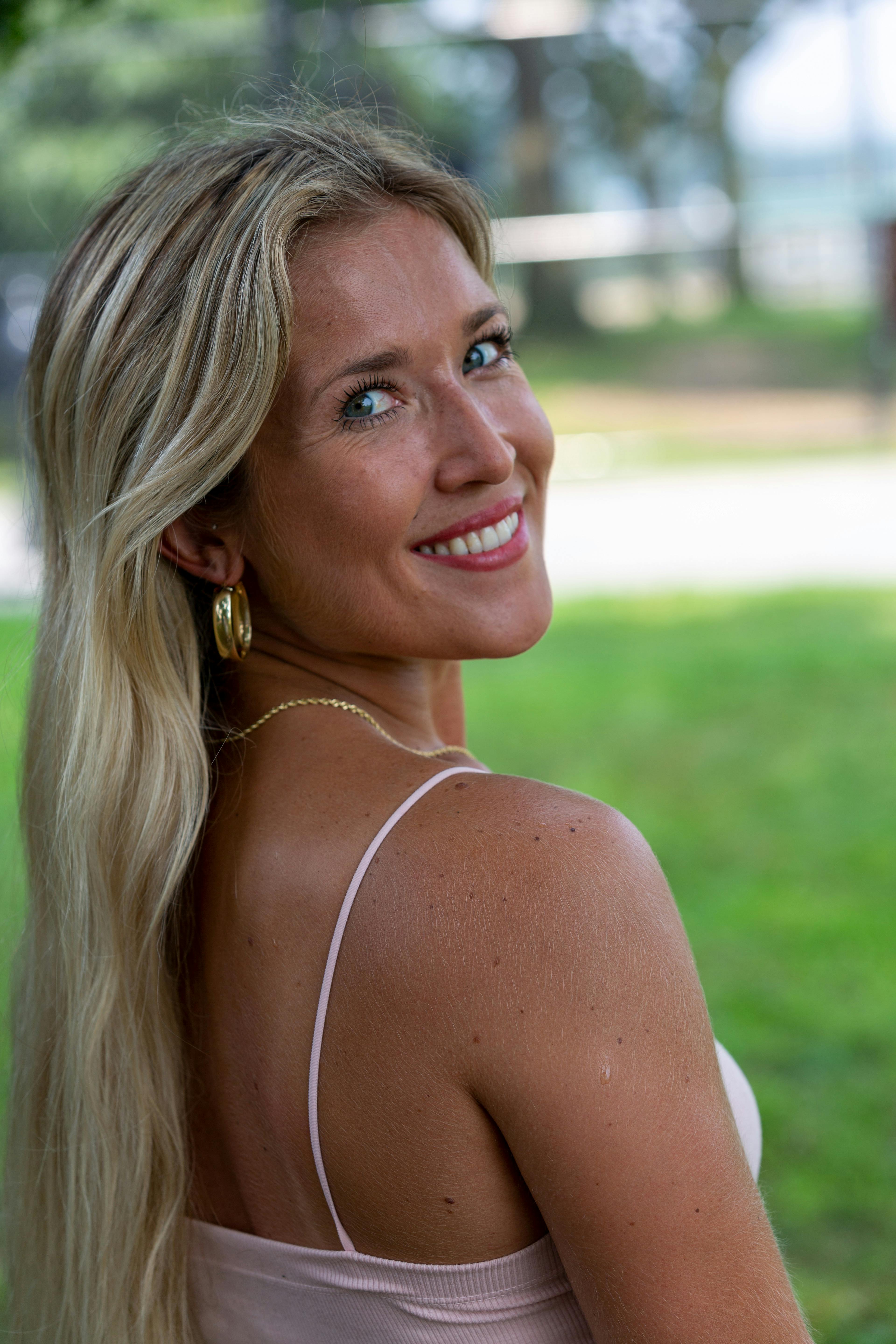 Woman in Sports Bra and Denim Pants · Free Stock Photo