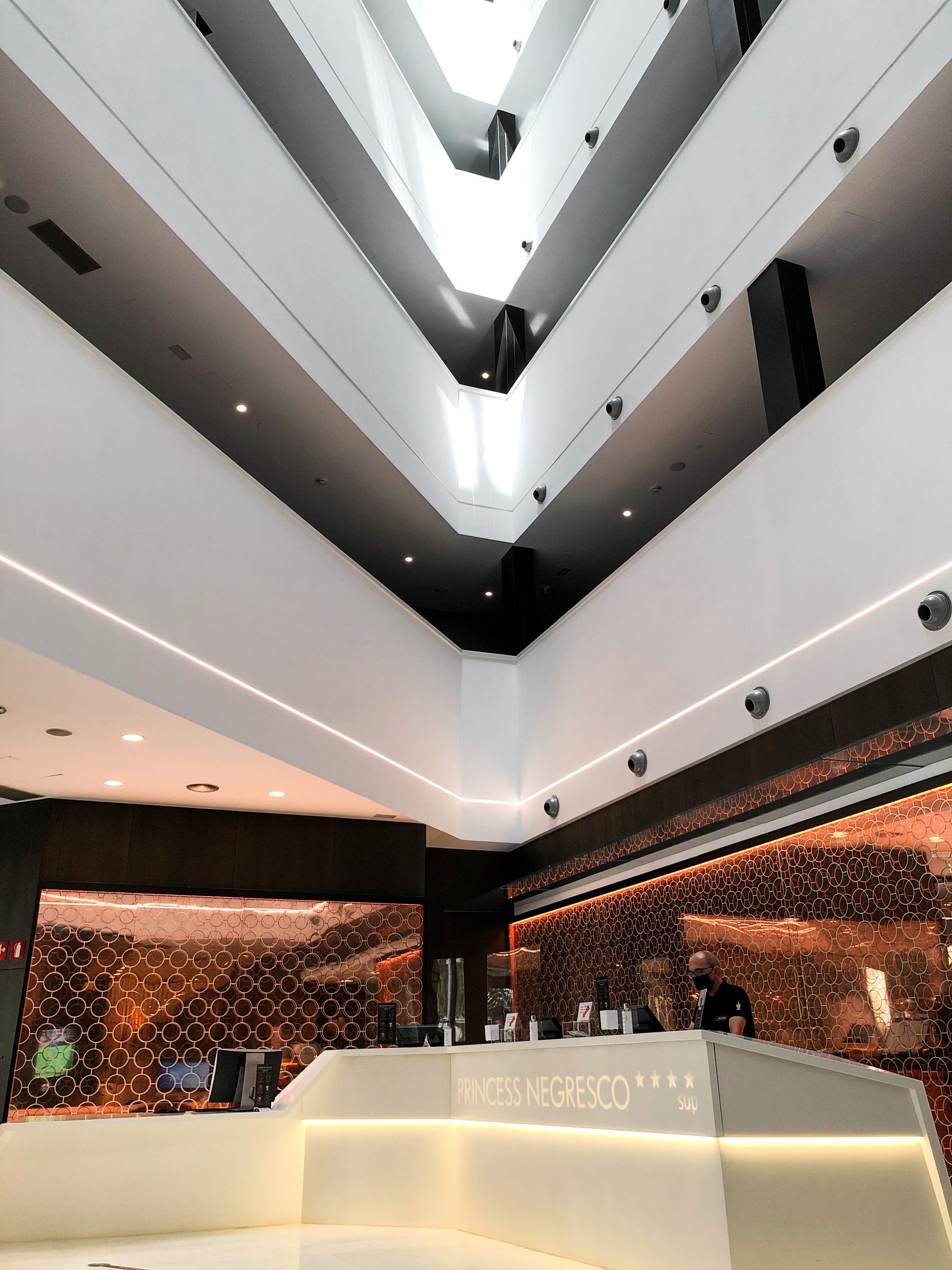 Luxury hotel lobby interior with contemporary furniture and warm lighting