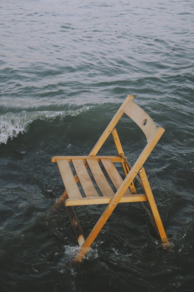  Wooden Folding Chair On Sea Water