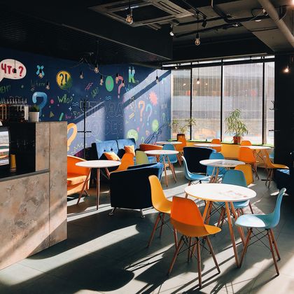 Bright cafe with painted mural wall — photo by Mikhail Morozov on Pexels