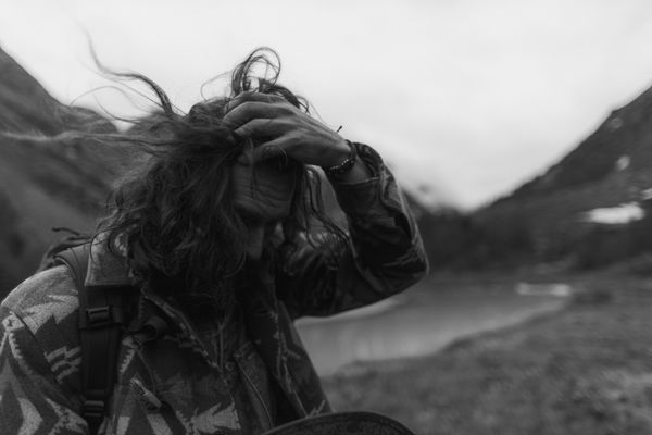 Man checking his hair in the mirror