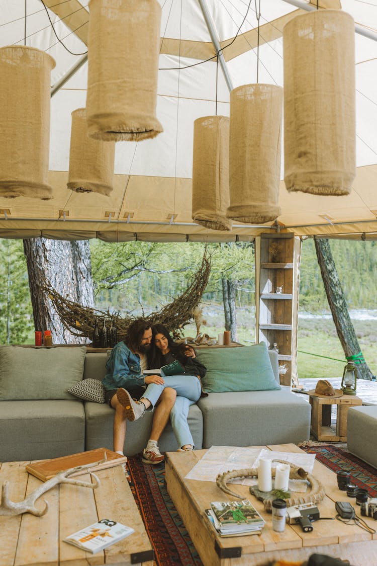 A Couple Sitting On The Couch