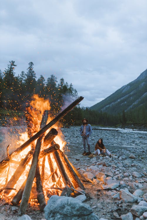 Couple Camping Near a Bonfire