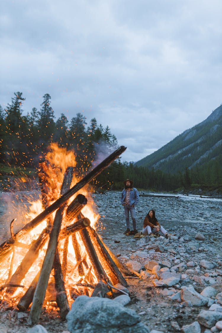 Couple Camping Near A Bonfire