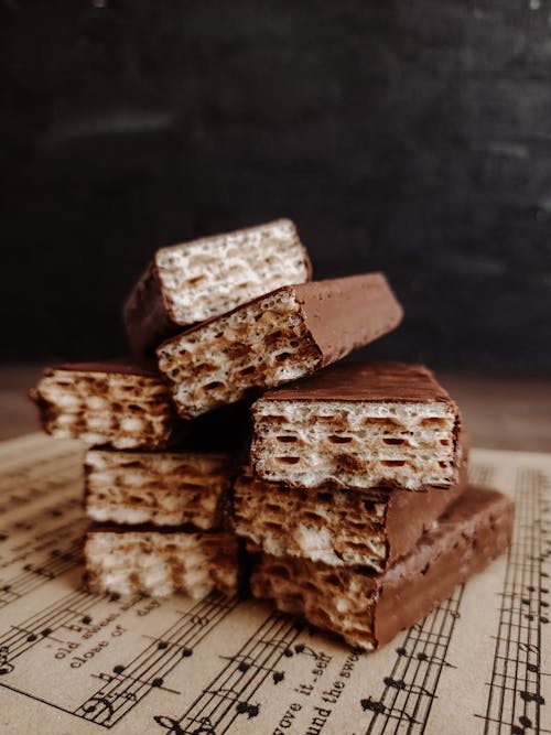 Free Chocolate Bars on Top of a Music Sheet Stock Photo