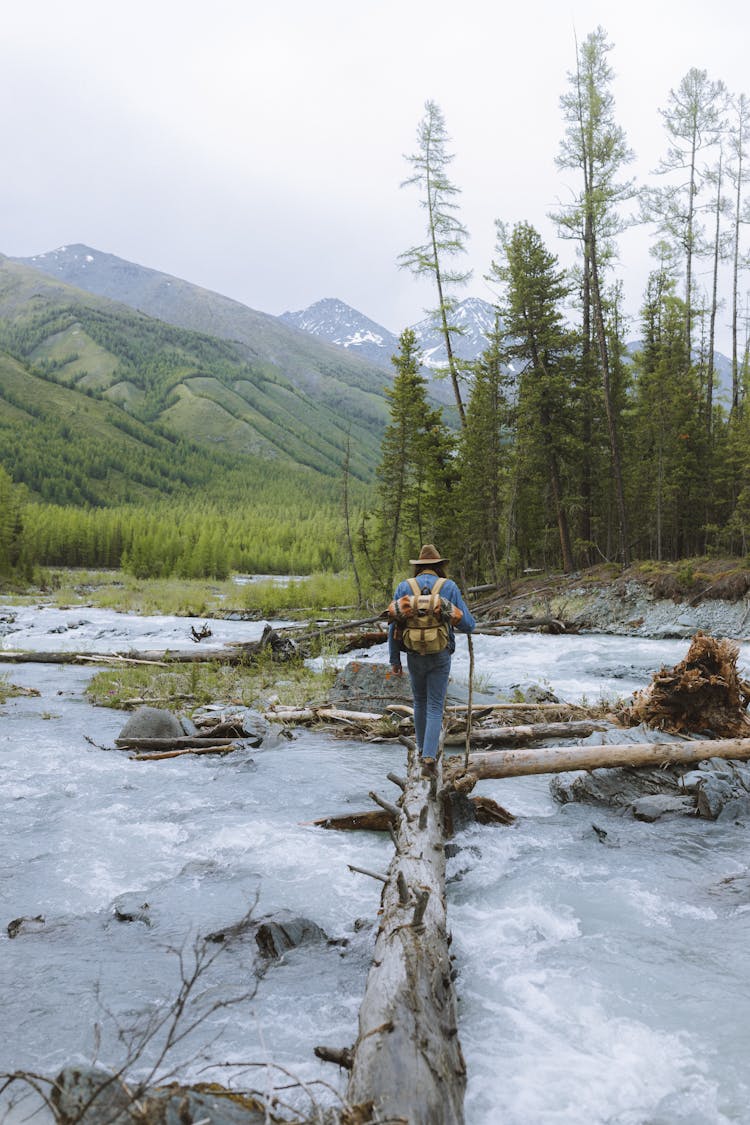 A Man Crossing A River