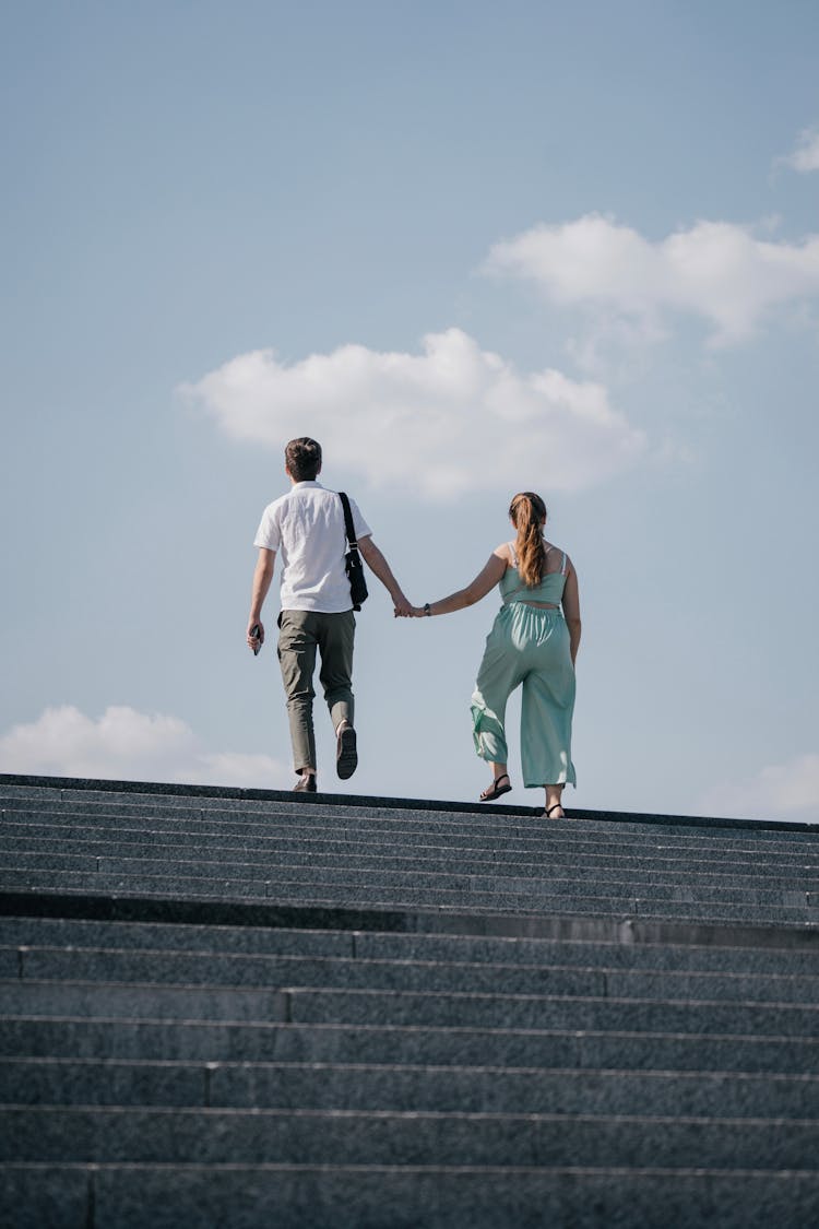 Couple Walking Up The Stairs