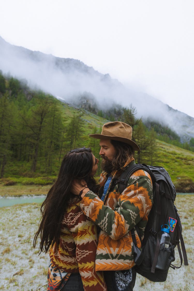 A Couple In Printed Long Sleeves Looking At Each Other