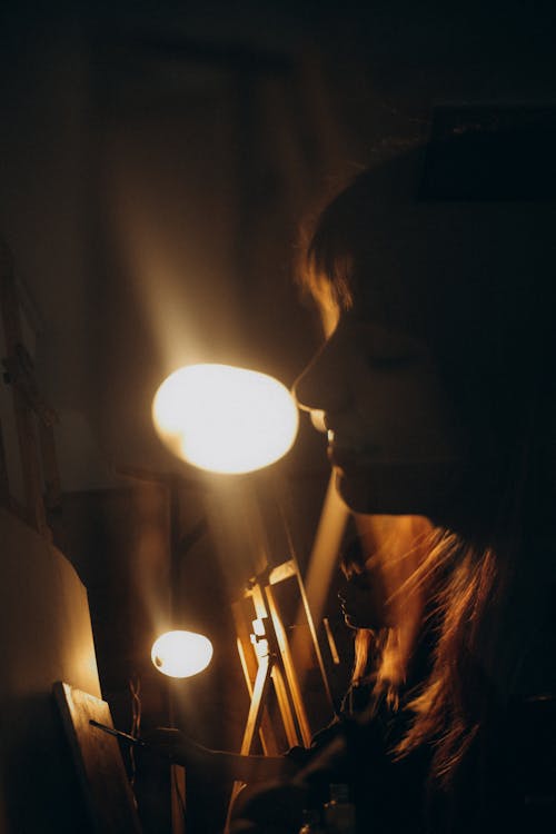 Reflection of a Woman Painting on a Canvas