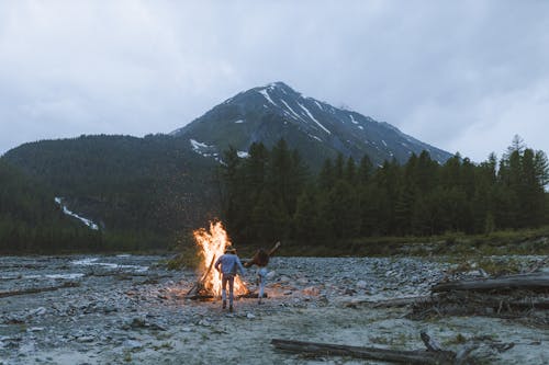 Couple Walking Around the Bonfire