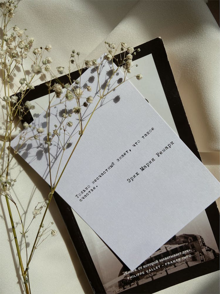 Baby's Breath Flowers Over White Paper With Written Note