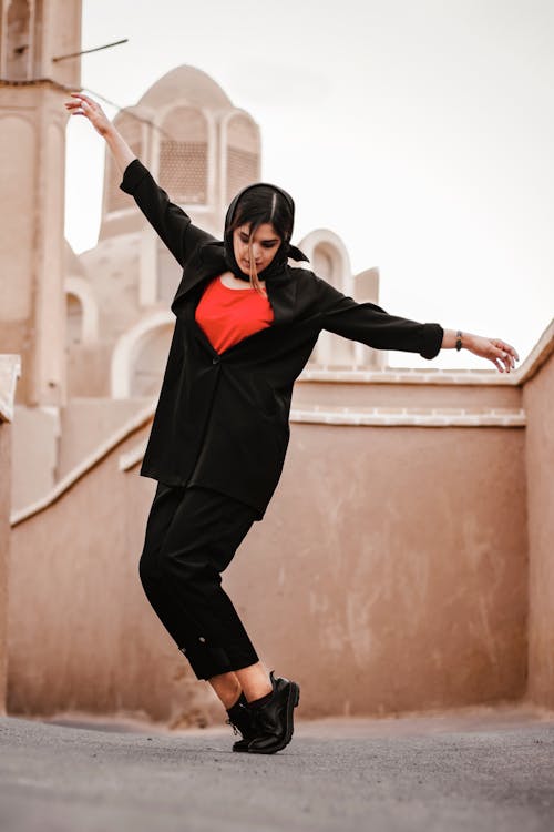 Free Woman in Black Long Sleeve Shirt and Pants Dancing Stock Photo