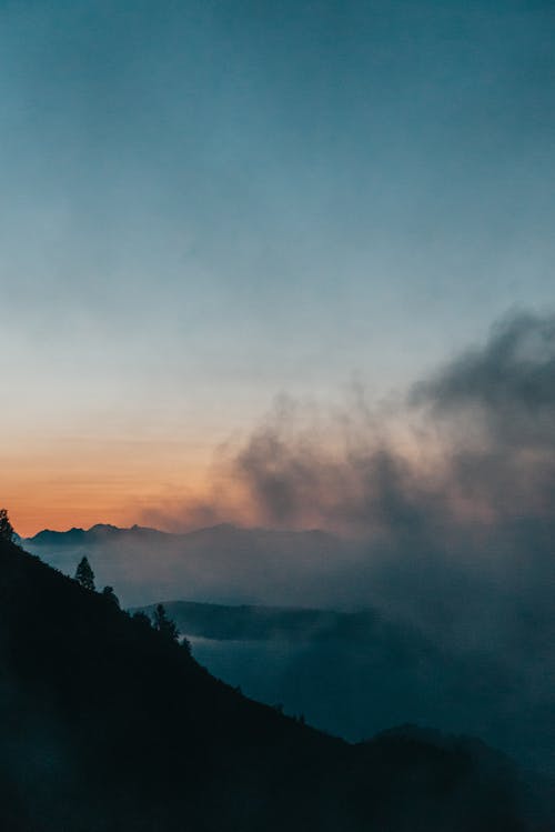 Silhouette of Mountain near Gray Sky