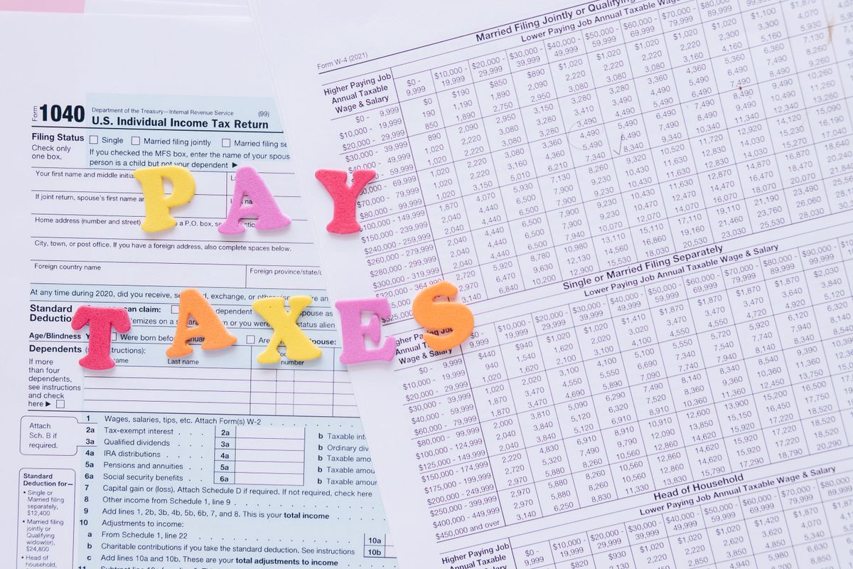 Close-up of U.S. tax forms with colorful lettering emphasizing tax deadlines and payments
