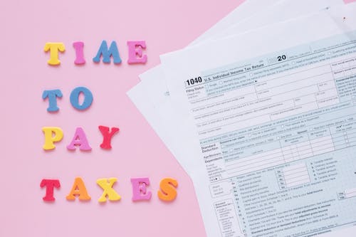 Times to Pay Taxes Sign by Documents