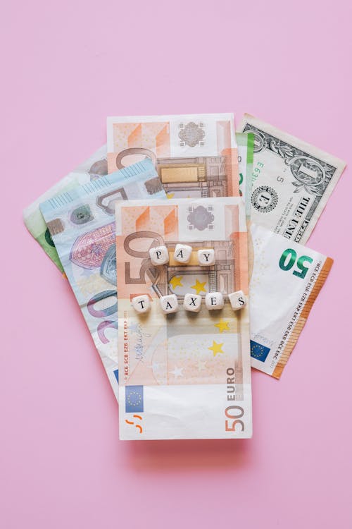 Bank Notes on Pink Background